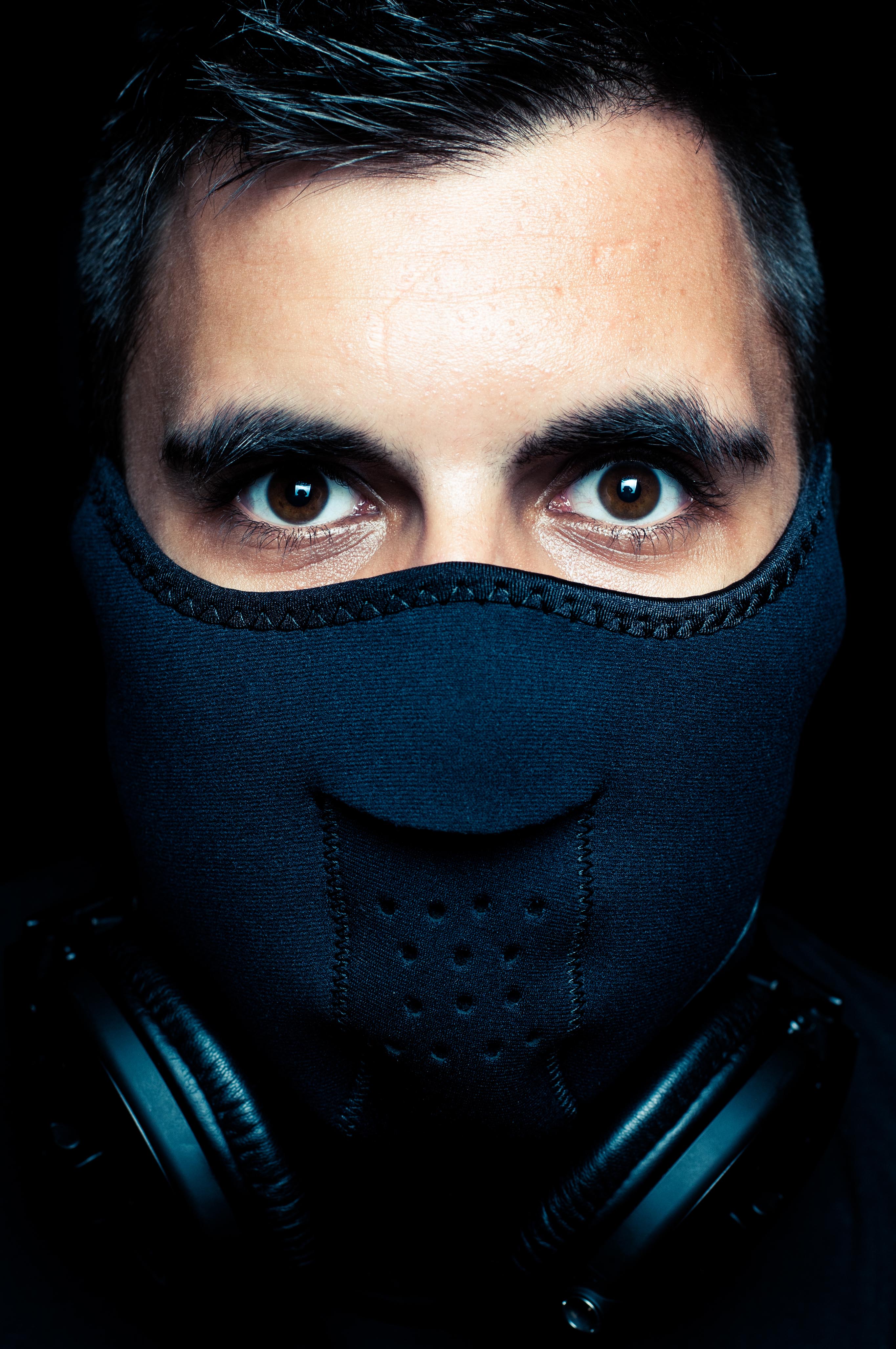 Frontal masked portrait of Max Cahill